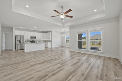 Built in 2021 and thoughtfully elevated beyond standard builds on Champion Golf Club in Florida - for sale on GolfHomes.com, golf home, golf lot