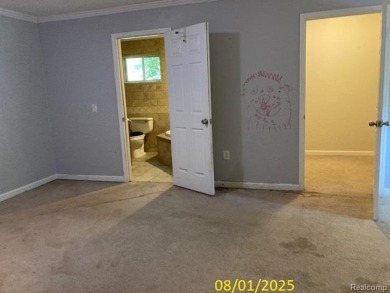 Make it your own in this two story home with 4 bedrooms and 2 on Rush Lake Hills Golf Club in Michigan - for sale on GolfHomes.com, golf home, golf lot