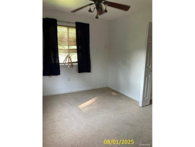Make it your own in this two story home with 4 bedrooms and 2 on Rush Lake Hills Golf Club in Michigan - for sale on GolfHomes.com, golf home, golf lot