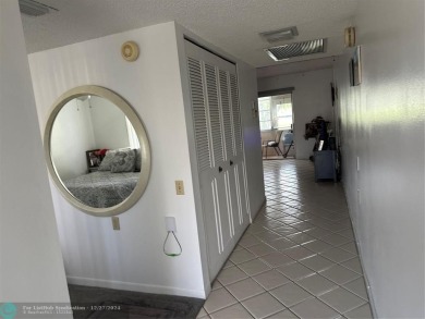 Beautiful unit 1/1 in Wynmoor 55+ won't last. First floor easy on Wynmoor Golf Course in Florida - for sale on GolfHomes.com, golf home, golf lot