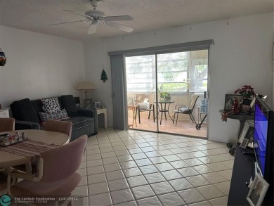Beautiful unit 1/1 in Wynmoor 55+ won't last. First floor easy on Wynmoor Golf Course in Florida - for sale on GolfHomes.com, golf home, golf lot