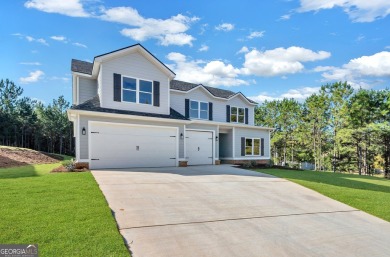 Nestled on the corner lot is an absolute gorgeous new on Canongate At Healy Point Country Club in Georgia - for sale on GolfHomes.com, golf home, golf lot