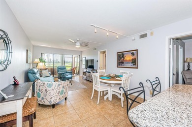 Welcome to this beautifully maintained turnkey 2-bedroom on Isla Del Sol Yacht and Country Club in Florida - for sale on GolfHomes.com, golf home, golf lot