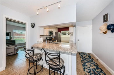 Welcome to this beautifully maintained turnkey 2-bedroom on Isla Del Sol Yacht and Country Club in Florida - for sale on GolfHomes.com, golf home, golf lot