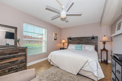 Welcome to this beautifully maintained turnkey 2-bedroom on Isla Del Sol Yacht and Country Club in Florida - for sale on GolfHomes.com, golf home, golf lot