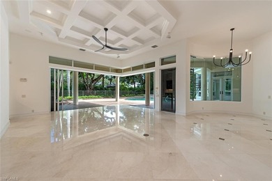 Tucked away on a quiet, tree-lined street in the exclusive on Colliers Reserve Country Club in Florida - for sale on GolfHomes.com, golf home, golf lot