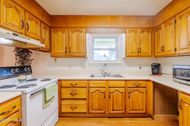 Beach Bungalow is located in the quaint neighborhood of Beach 87 on Sharks Tooth Golf Club in Florida - for sale on GolfHomes.com, golf home, golf lot