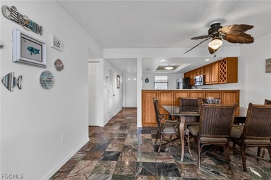 Just steps from your screened lanai to your private dock and on Saint Andrews South Golf Club in Florida - for sale on GolfHomes.com, golf home, golf lot