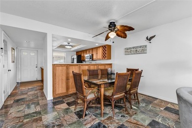 Just steps from your screened lanai to your private dock and on Saint Andrews South Golf Club in Florida - for sale on GolfHomes.com, golf home, golf lot