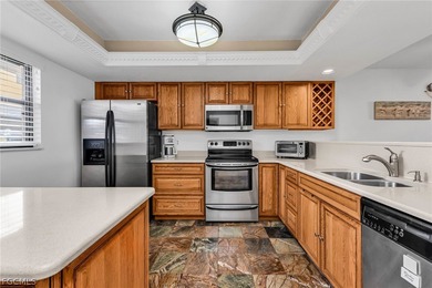 Just steps from your screened lanai to your private dock and on Saint Andrews South Golf Club in Florida - for sale on GolfHomes.com, golf home, golf lot