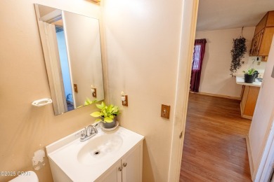 Beach Bungalow is located in the quaint neighborhood of Beach 87 on Sharks Tooth Golf Club in Florida - for sale on GolfHomes.com, golf home, golf lot