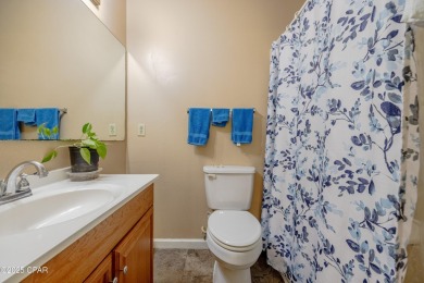 Beach Bungalow is located in the quaint neighborhood of Beach 87 on Sharks Tooth Golf Club in Florida - for sale on GolfHomes.com, golf home, golf lot