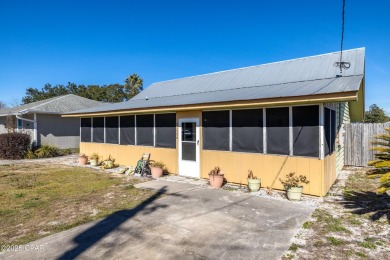 Beach Bungalow is located in the quaint neighborhood of Beach 87 on Sharks Tooth Golf Club in Florida - for sale on GolfHomes.com, golf home, golf lot