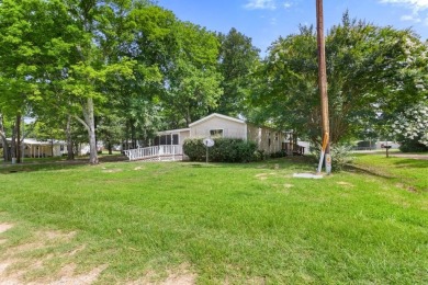 Discover this charming 2-bedroom, 2-bath retreat nestled under a on Links At Lands End in Texas - for sale on GolfHomes.com, golf home, golf lot