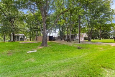 Discover this charming 2-bedroom, 2-bath retreat nestled under a on Links At Lands End in Texas - for sale on GolfHomes.com, golf home, golf lot