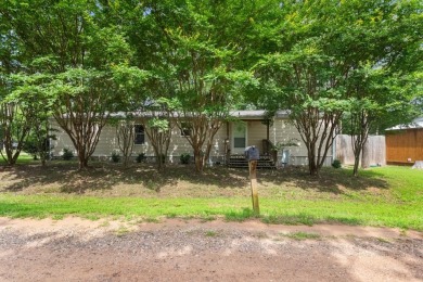 Discover this charming 2-bedroom, 2-bath retreat nestled under a on Links At Lands End in Texas - for sale on GolfHomes.com, golf home, golf lot