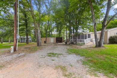 Discover this charming 2-bedroom, 2-bath retreat nestled under a on Links At Lands End in Texas - for sale on GolfHomes.com, golf home, golf lot
