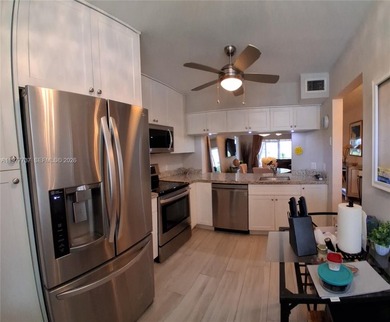 Beautifully remodeled, move-in-ready, two-bedroom, two-bathroom on Sunrise Lakes Phase IV Golf Course in Florida - for sale on GolfHomes.com, golf home, golf lot