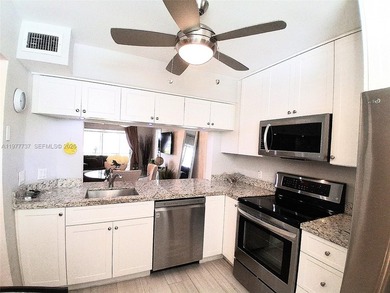 Beautifully remodeled, move-in-ready, two-bedroom, two-bathroom on Sunrise Lakes Phase IV Golf Course in Florida - for sale on GolfHomes.com, golf home, golf lot