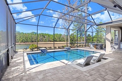 LIVE exceptionally in this 2022 custom-upgraded waterfront on Southern Hills Plantation Club in Florida - for sale on GolfHomes.com, golf home, golf lot