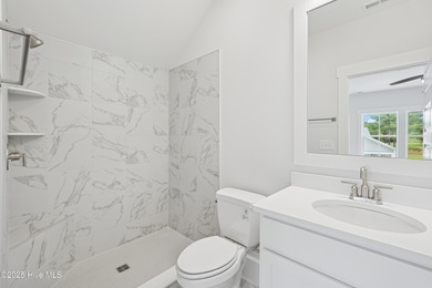 Discover the Skiff, a beautiful new Logan Home, located in on Sea Trail Golf Resort in North Carolina - for sale on GolfHomes.com, golf home, golf lot