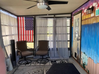 This 2/1.5 manufactured home is priced to sell. It is nestled up on Lake Henry Golf Club in Florida - for sale on GolfHomes.com, golf home, golf lot