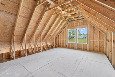 Discover the Skiff, a beautiful new Logan Home, located in on Sea Trail Golf Resort in North Carolina - for sale on GolfHomes.com, golf home, golf lot