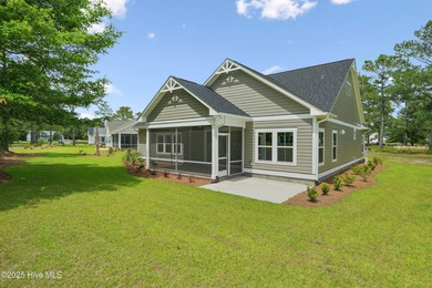 Discover the Skiff, a beautiful new Logan Home, located in on Sea Trail Golf Resort in North Carolina - for sale on GolfHomes.com, golf home, golf lot