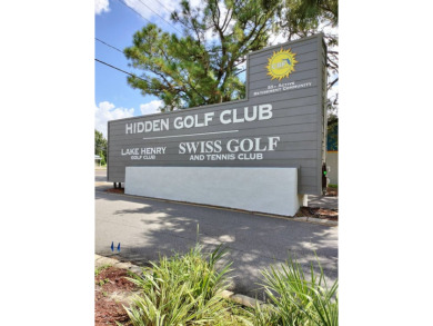 This 2/1.5 manufactured home is priced to sell. It is nestled up on Lake Henry Golf Club in Florida - for sale on GolfHomes.com, golf home, golf lot