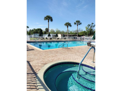 This 2/1.5 manufactured home is priced to sell. It is nestled up on Lake Henry Golf Club in Florida - for sale on GolfHomes.com, golf home, golf lot