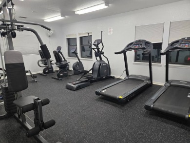 This 2/1.5 manufactured home is priced to sell. It is nestled up on Lake Henry Golf Club in Florida - for sale on GolfHomes.com, golf home, golf lot