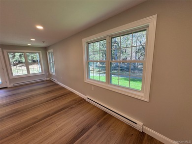 This completely renovated extraordinary Greenbriar model end on Leisure Village Golf Course in New York - for sale on GolfHomes.com, golf home, golf lot