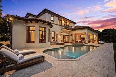 Nestled behind the private gates of Bay Colony Shores, this on Club at Pelican Bay Golf Course in Florida - for sale on GolfHomes.com, golf home, golf lot