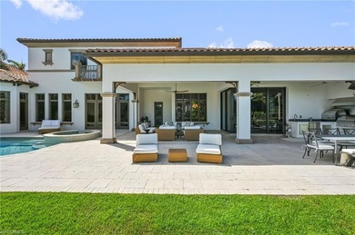 Nestled behind the private gates of Bay Colony Shores, this on Club at Pelican Bay Golf Course in Florida - for sale on GolfHomes.com, golf home, golf lot