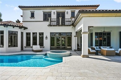 Nestled behind the private gates of Bay Colony Shores, this on Club at Pelican Bay Golf Course in Florida - for sale on GolfHomes.com, golf home, golf lot