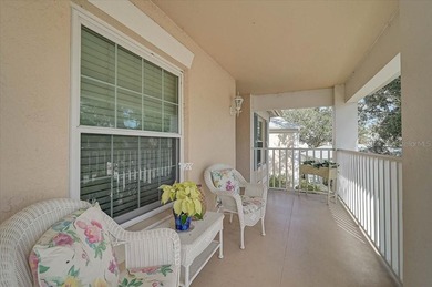 Welcome to this beautiful second-floor end-unit condominium on Peridia Golf and Country Club in Florida - for sale on GolfHomes.com, golf home, golf lot