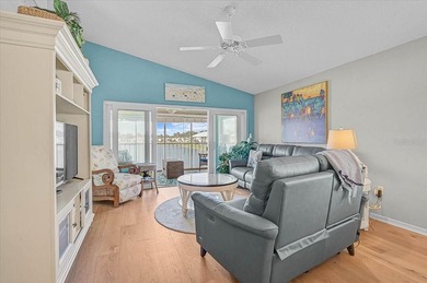 Welcome to this beautiful second-floor end-unit condominium on Peridia Golf and Country Club in Florida - for sale on GolfHomes.com, golf home, golf lot
