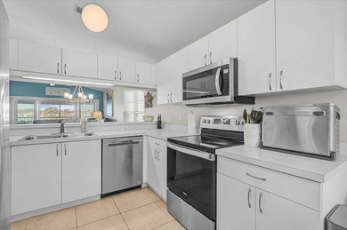 Welcome to this beautiful second-floor end-unit condominium on Peridia Golf and Country Club in Florida - for sale on GolfHomes.com, golf home, golf lot