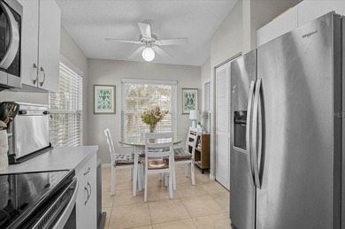 Welcome to this beautiful second-floor end-unit condominium on Peridia Golf and Country Club in Florida - for sale on GolfHomes.com, golf home, golf lot