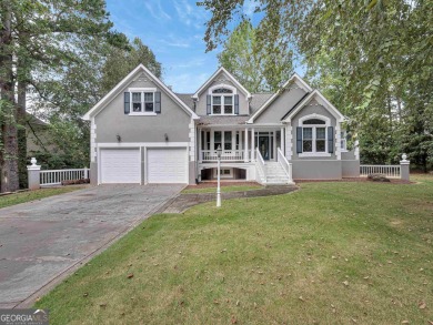 Step into a golfer's dream, tucked away in the renowned Reynolds on Great Waters Course At Reynolds Plantation in Georgia - for sale on GolfHomes.com, golf home, golf lot