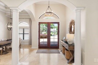 Updated, custom-built home nestled within the highly desirable on Regatta Bay Golf and Country Club in Florida - for sale on GolfHomes.com, golf home, golf lot