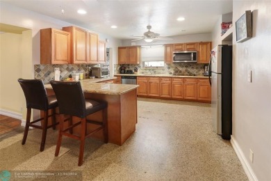 This charming 3-bedroom, 2-bathroom home offers a spacious on Pompano Beach Golf Course  in Florida - for sale on GolfHomes.com, golf home, golf lot