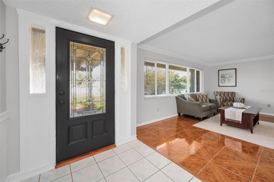 Welcome to an exceptional three-bedroom, two bath, one story on The Dunedin Country Club in Florida - for sale on GolfHomes.com, golf home, golf lot