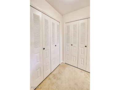 This METICULOUSLY-MAINTAINED *condo-villa* with a BRAND NEW ROOF on Myerlee Country Club in Florida - for sale on GolfHomes.com, golf home, golf lot