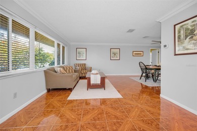 Welcome to an exceptional three-bedroom, two bath, one story on The Dunedin Country Club in Florida - for sale on GolfHomes.com, golf home, golf lot