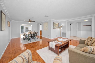 Welcome to an exceptional three-bedroom, two bath, one story on The Dunedin Country Club in Florida - for sale on GolfHomes.com, golf home, golf lot