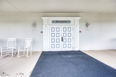 This METICULOUSLY-MAINTAINED *condo-villa* with a BRAND NEW ROOF on Myerlee Country Club in Florida - for sale on GolfHomes.com, golf home, golf lot