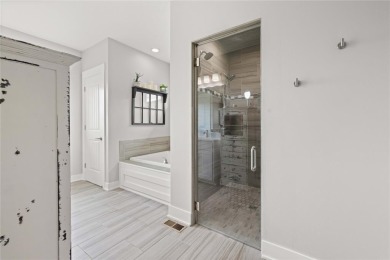This zero-entry ranch home offers a blend of comfort and modern on Otter Creek Golf Course in Iowa - for sale on GolfHomes.com, golf home, golf lot