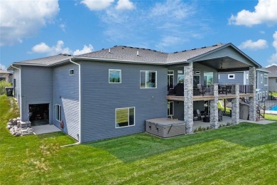 This zero-entry ranch home offers a blend of comfort and modern on Otter Creek Golf Course in Iowa - for sale on GolfHomes.com, golf home, golf lot