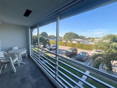 Immaculately maintained with newer updates! Move right into this on Hillsboro Pines Golf in Florida - for sale on GolfHomes.com, golf home, golf lot